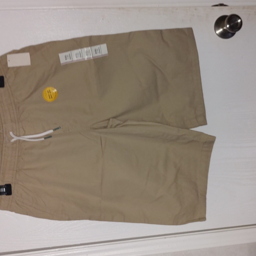 New. Boys shorts, one is tan and one is light gray size 18